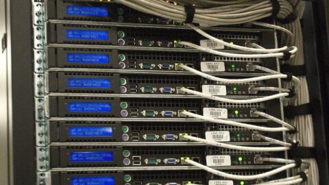 A close-up of a server rack with network cabling in a data center